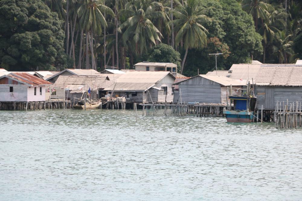 Karimata is what is know as a stilt village,  most or all of the homes being built on pilings over the water.  This is  usually do to the land being too steep to build along the water front.